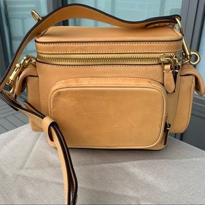 Coach utility crossbody bag in tumeric color. Original leather. Like new. Unisex